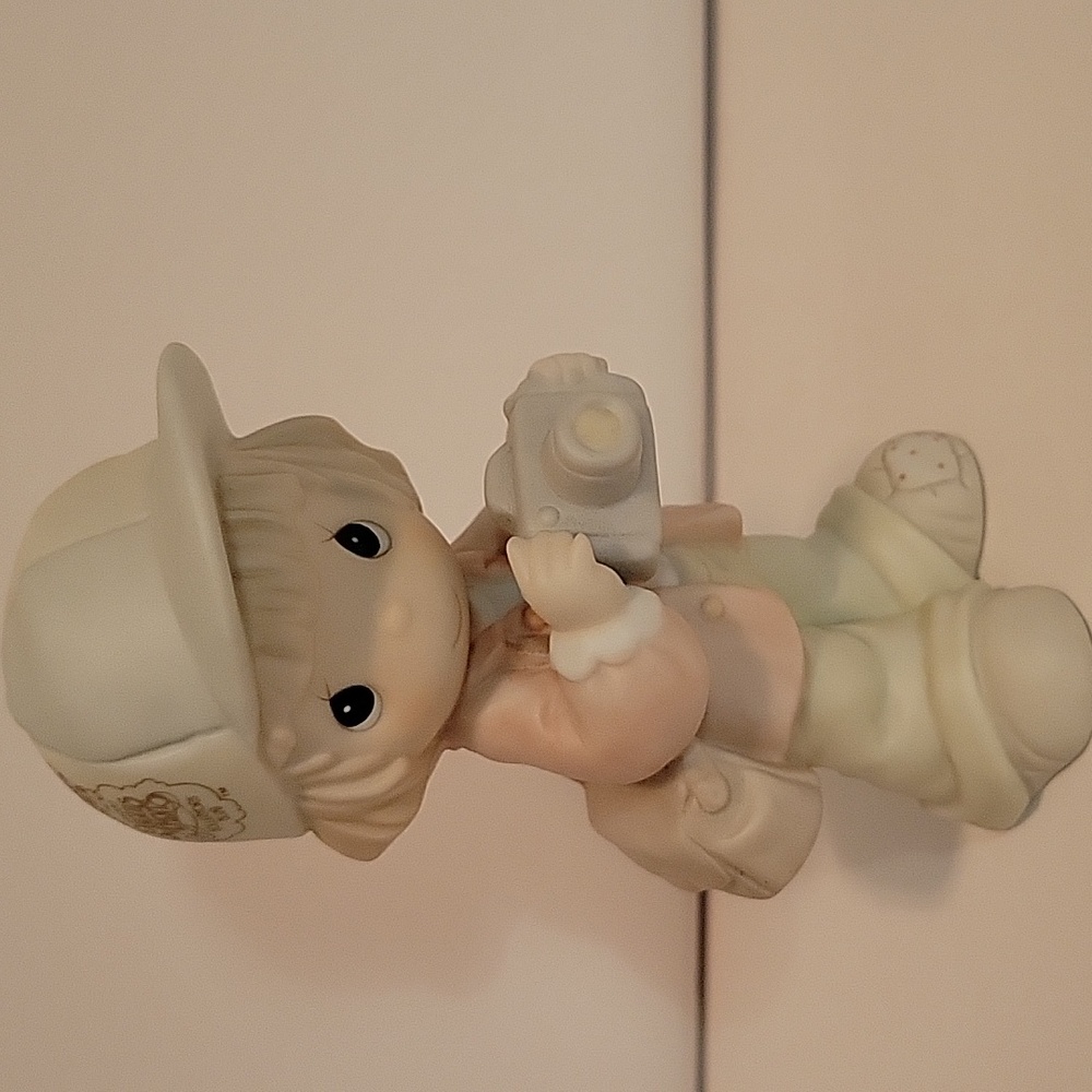 Precious Moments figurine, boy with camera.